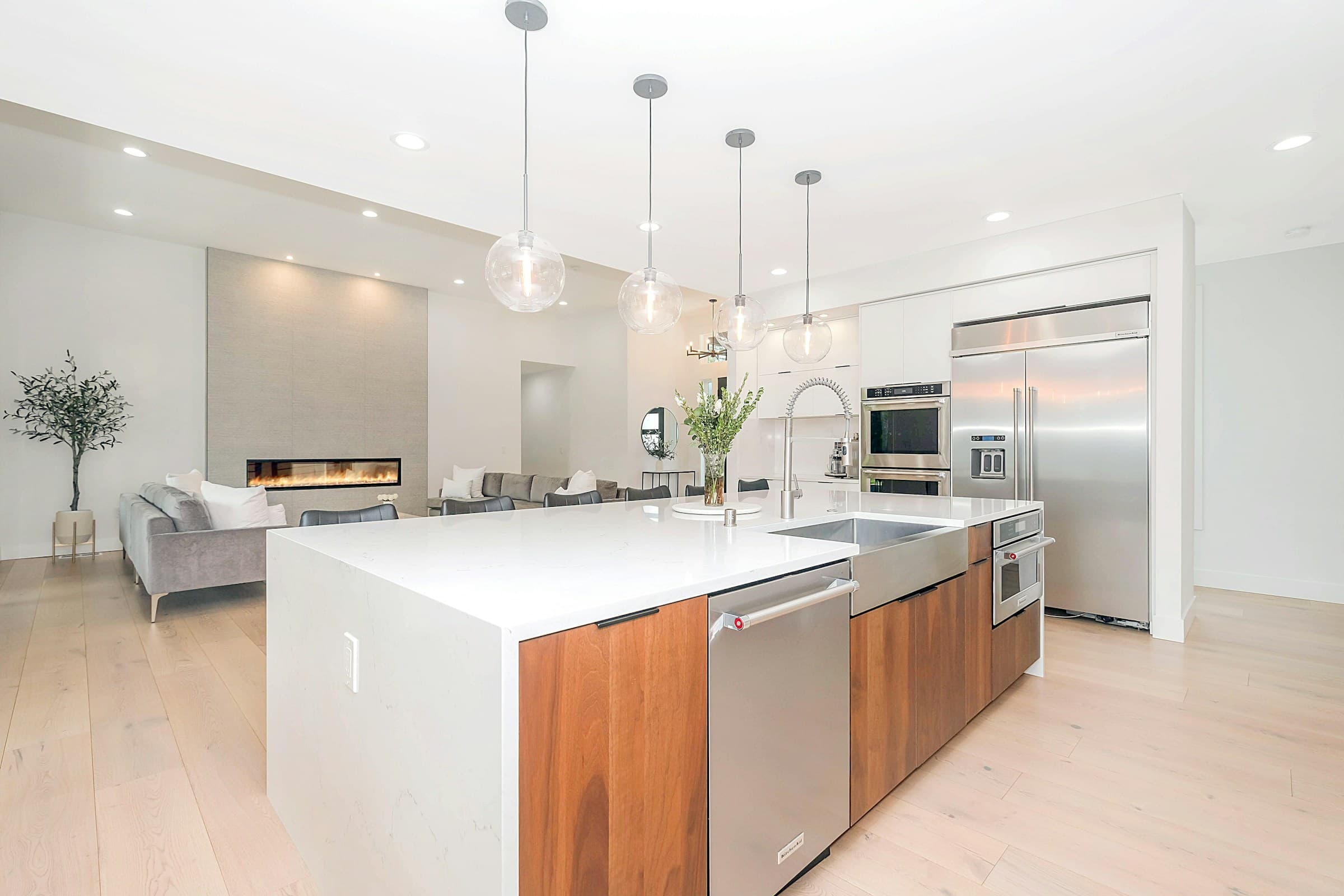 A bright, modern kitchen with morning light across the island